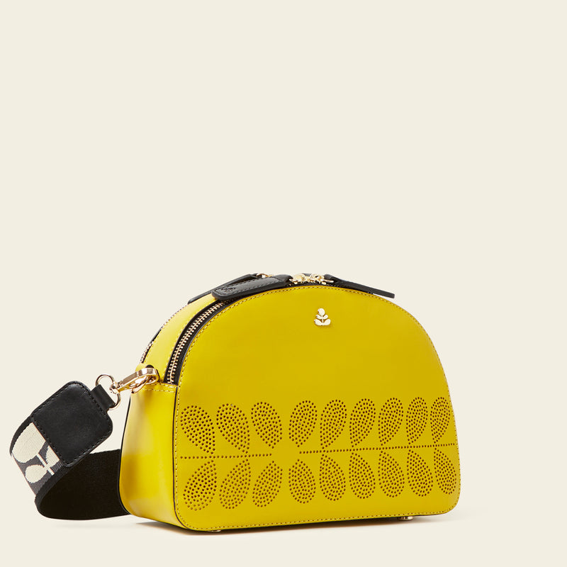 Luna Crossbody Bag in Daffodil Punched Flower by Orla Kiely