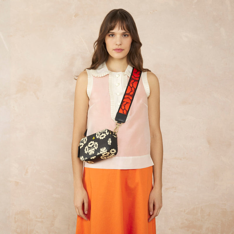 Model wearing the Duo Crossbody Bag in Posey Flower Midnight pattern by Orla Kiely